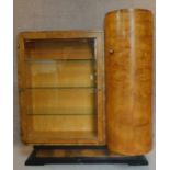 A Continental Art Deco burr walnut display cabinet with cupboard to side enclosed by a demi lune