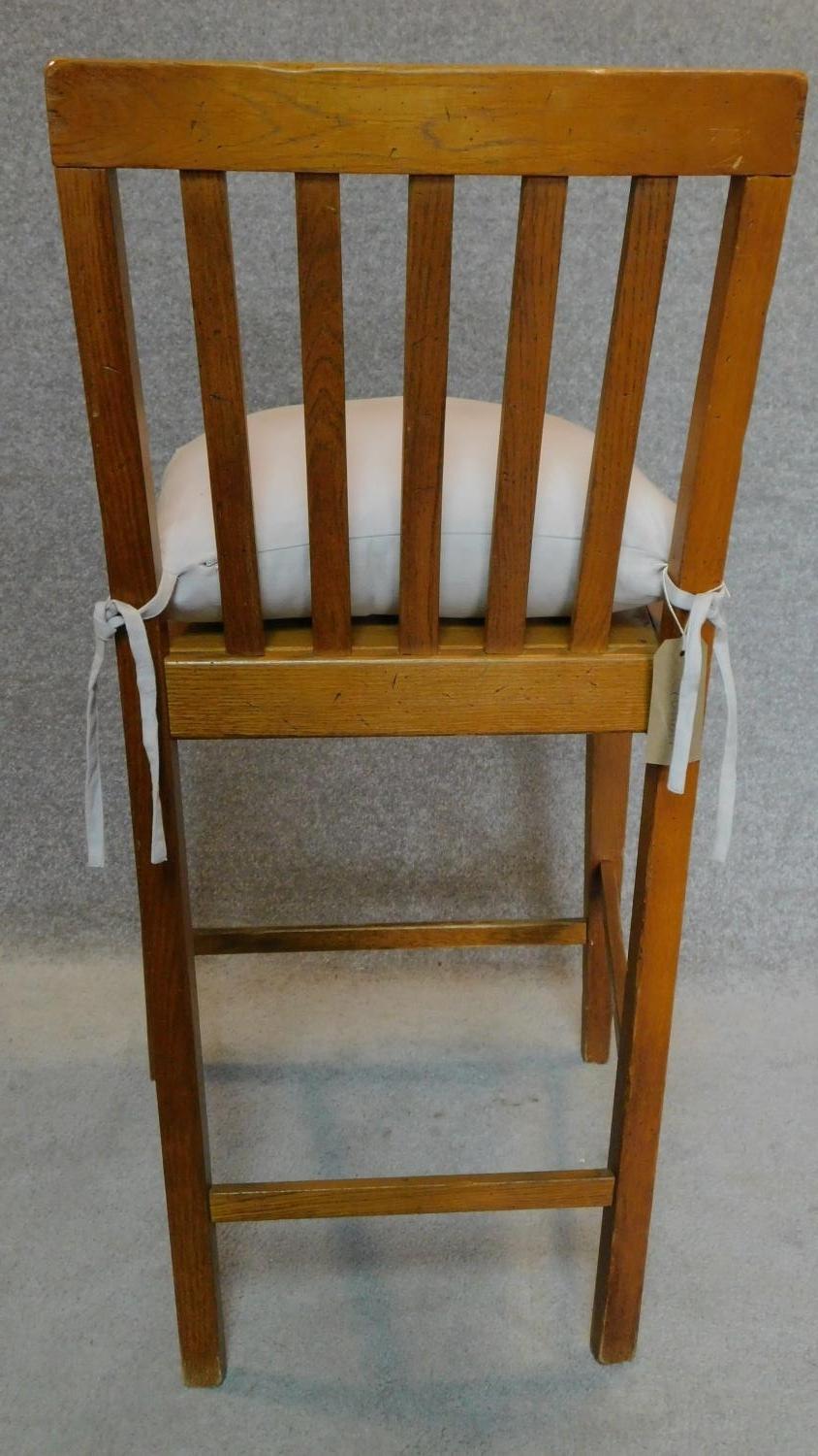 A pair of teak framed side chairs with squab cushions. H.98cm - Image 3 of 4