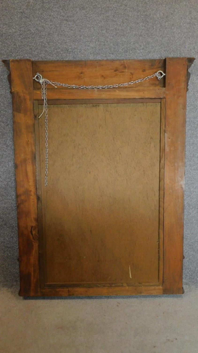A late 19th century Continental carved walnut overmantel mirror fitted bevelled plate. 114x89cm - Image 5 of 5