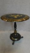 A papier mach tilt top table with painted floral decoration and mother of pearl inlay on baluster