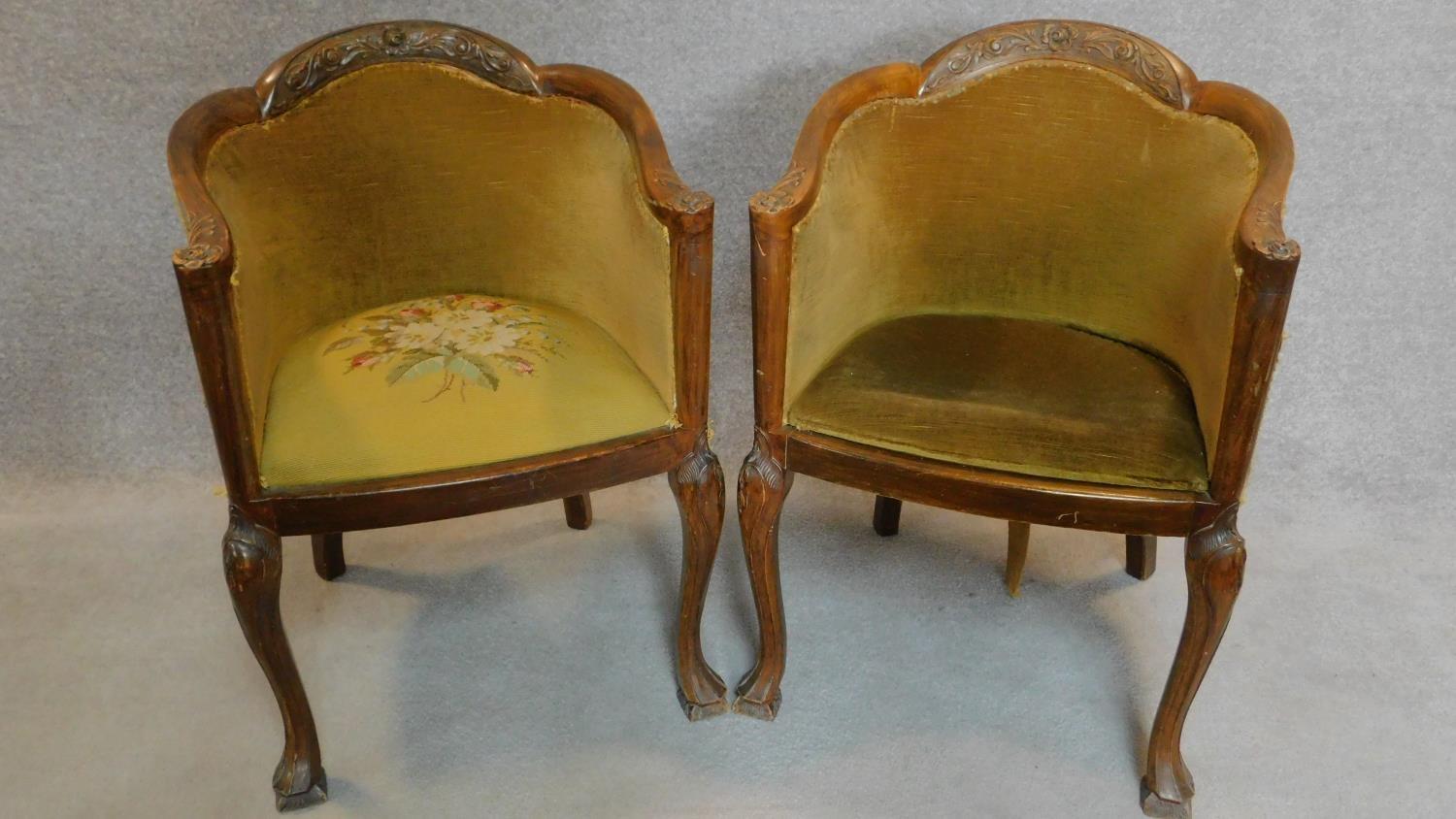 A pair of mid 20th century Queen Anne style walnut tub chairs on cabriole supports. H.84cm