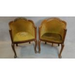 A pair of mid 20th century Queen Anne style walnut tub chairs on cabriole supports. H.84cm