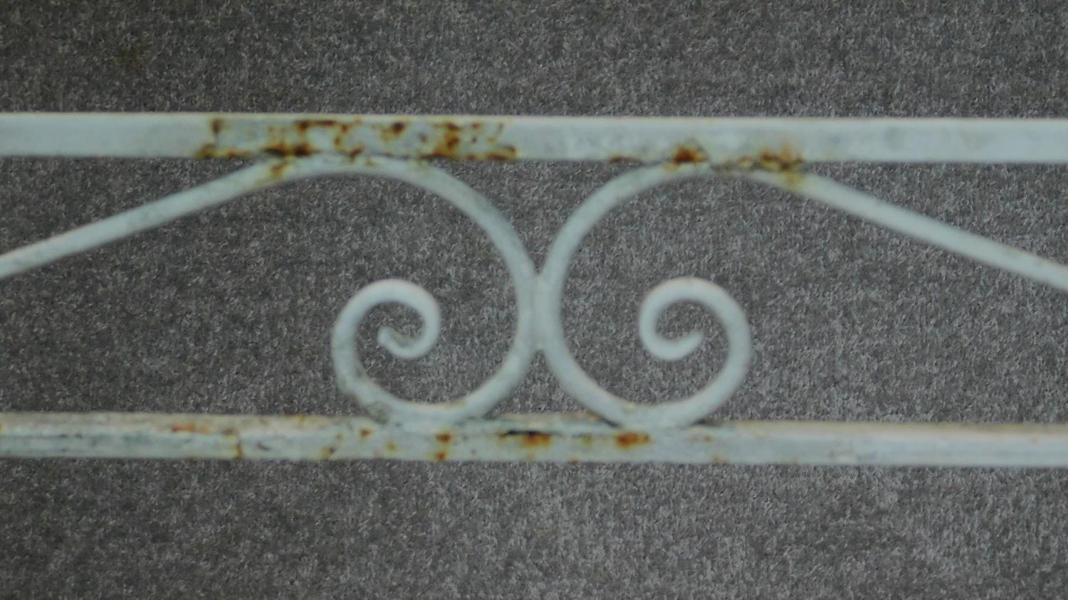 A wrought iron and painted garden table base. H.76 W.153 D.77cm - Image 3 of 4