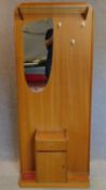 A 1960's vintage teak hallstand fitted mirror, hanging rail and cupboard. 186x78cm