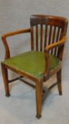 A late 19th century oak desk chair. H.95cm