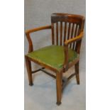 A late 19th century oak desk chair. H.95cm