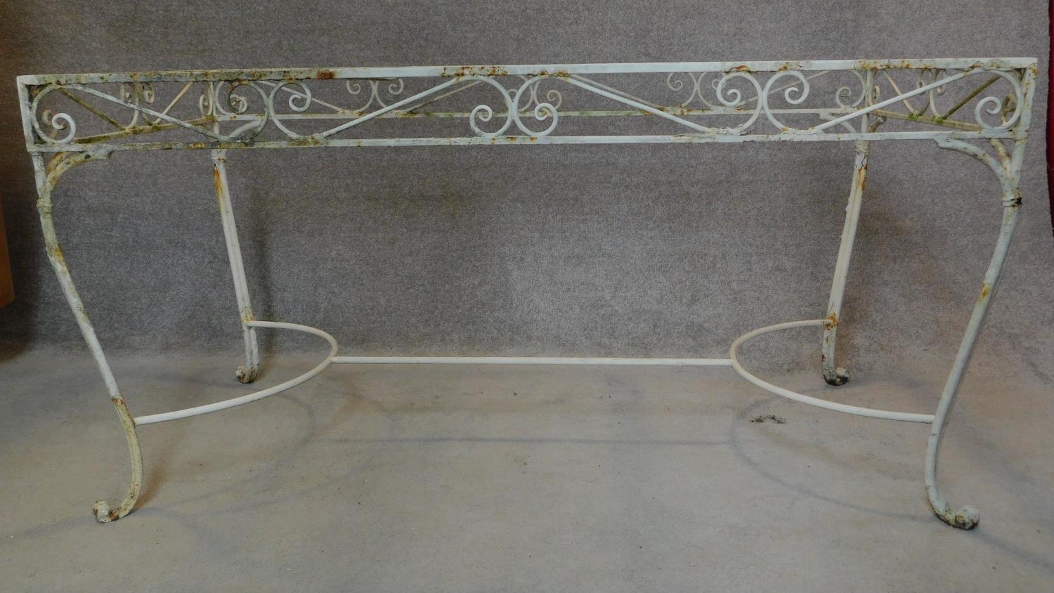 A wrought iron and painted garden table base. H.76 W.153 D.77cm - Image 2 of 4