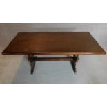 A Jacobean style oak refectory style dining table. 74x166x75cm