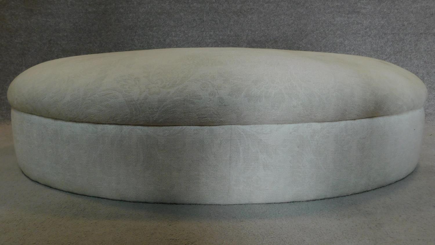 A large oval upholstered ottoman. H.27 W.123 D.95cm - Image 2 of 6