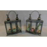A pair of terrariums with swing carrying handles. H.45