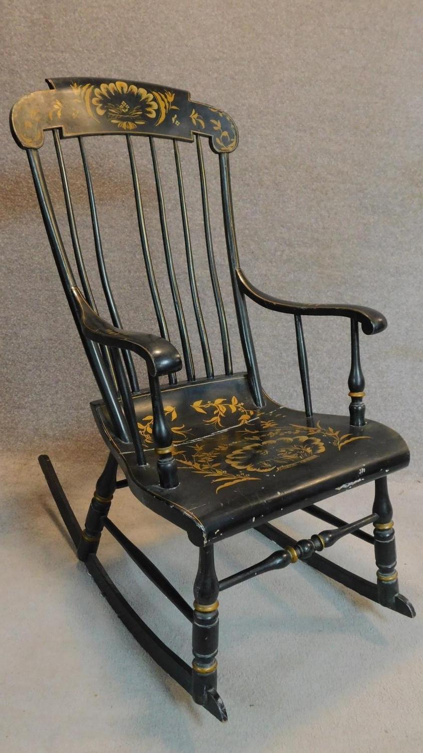 A 19th century ebonised and gilt painted rocking chair. H.113cm