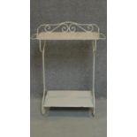 A 19th century French wrought iron washstand on scroll supports united by pot board. H.91cm