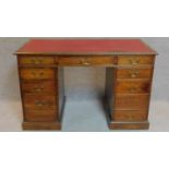 A late Victorian mahogany three section pedestal desk fitted nine drawers with makers label.