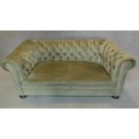 A Victorian buttoned back Chesterfield sofa in green upholstery. H.65 W.180 D.90cm