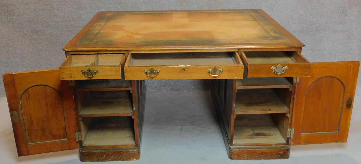 A Victorian oak partners desk with original tooled leather top above frieze drawers and pedestal - Image 3 of 8