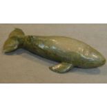 A carved soapstone figure of a whale, inscribed. W.52cm