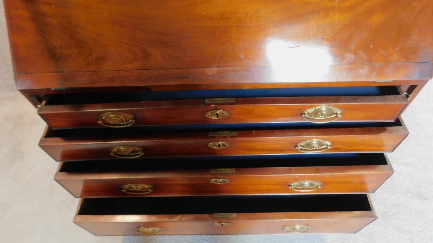 A Georgian mahogany bureau bookcase, the astragal glazed upper section above fall front revealing - Image 3 of 14