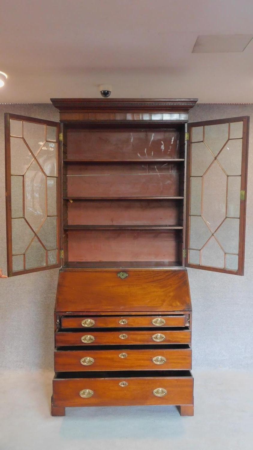 A Georgian mahogany bureau bookcase, the astragal glazed upper section above fall front revealing - Image 2 of 14