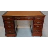 A late 19th century three part walnut pedestal desk, fitted tooled leather inset top and an