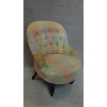 A late Victorian buttoned back nursing chair. H.78cm