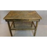 A rattan side table fitted side drawer on square supports united by woven undertier. H.69 W.90 D.