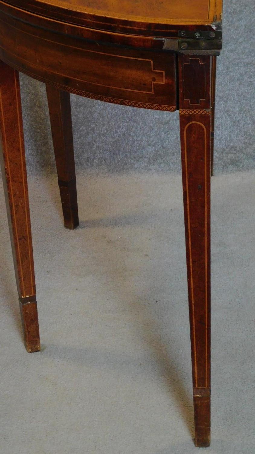 A Georgian mahogany and satinwood strung demi lune foldover top card table on square tapering - Image 8 of 8