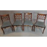 A set of four mahogany Regency style dining chairs on sabre supports. H.81cm