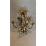 A brass and crystal ceiling chandelier of naturalistic form. 65x53cm