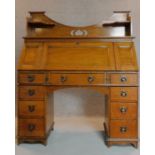 An Art Nouveau style oak bureau with well fitted interior, patented and with makers label. H.142 W.