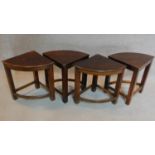 A set of four corner tables to form a circular low table, makers label to underside. H.49cm