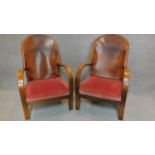A pair of mid 20th century leather backed armchairs. H.92cm