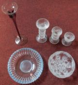 A coloured glass stem vase, a set of graduating candelabras and two glass dishes.