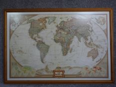 A large framed and glazed map of the world. 86x125