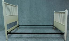 A white painted single bedstead in the Mackintosh style. H.137 H.202 D.109cm