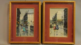 A pair of framed and glazed oils on board, continental street scenes in the rain, signed T