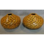 A pair of lattice constructed wooden vases. H.30cm