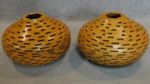 A pair of lattice constructed wooden vases. H.30cm