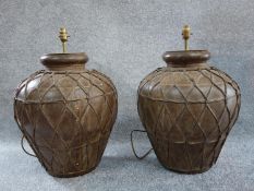 A pair of large Eastern style metal lamp bases. H.48