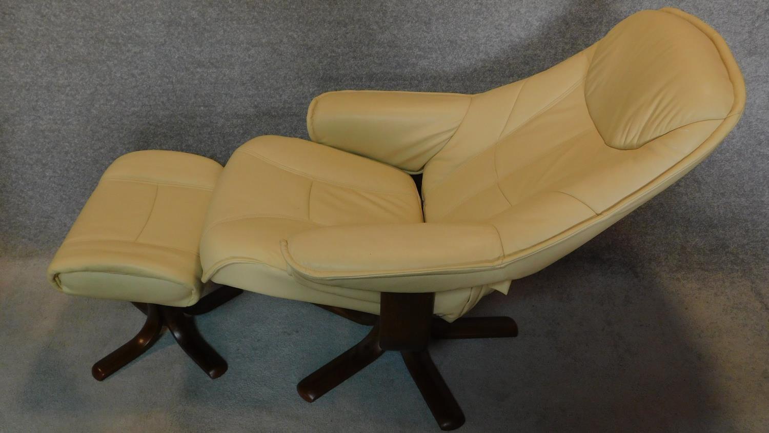 A pair of leather swivelling adjustable reclining armchairs with matching footstools. H.106cm - Image 6 of 6