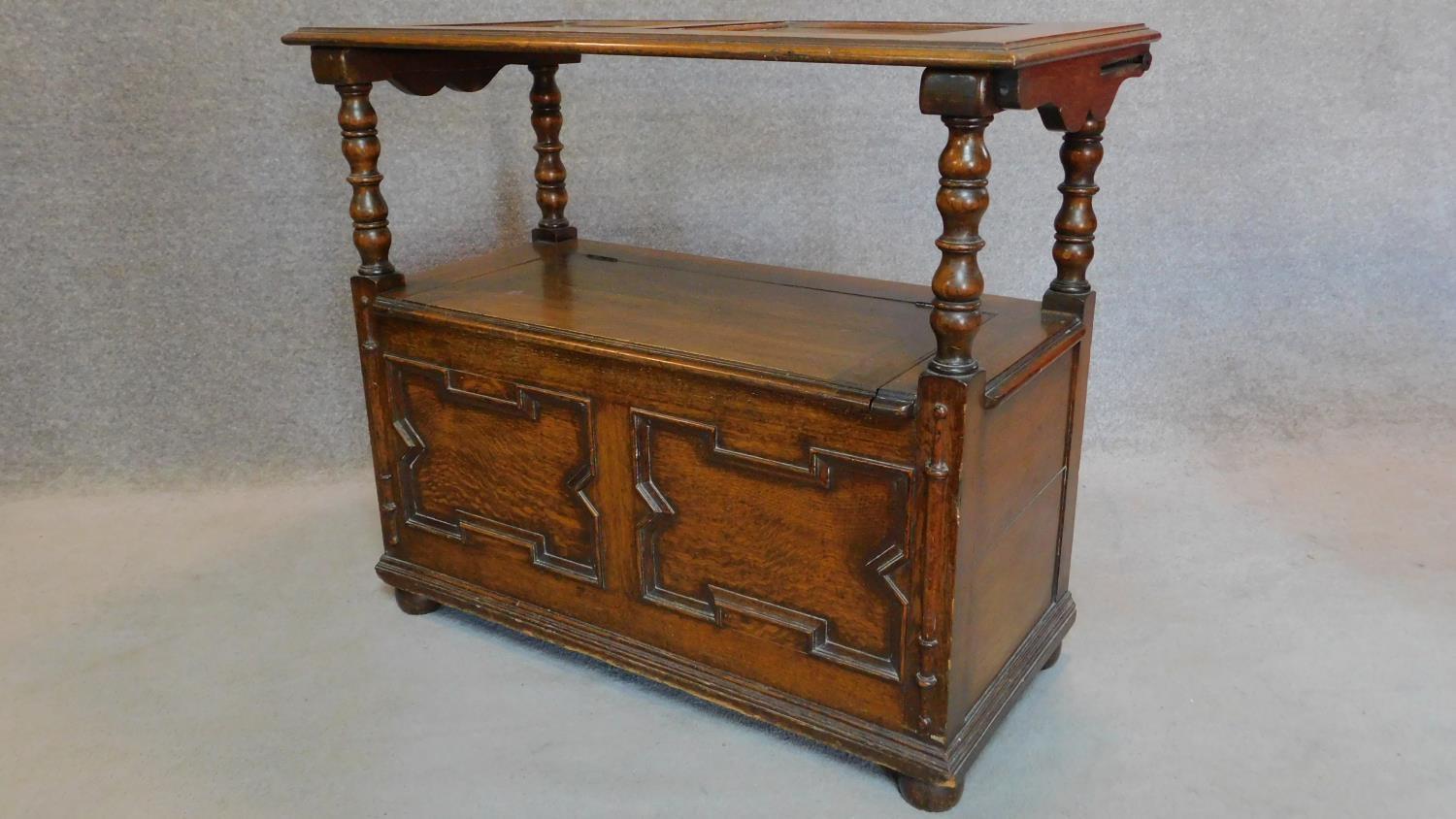 A mid 20th century oak Jacobean style monk's bench with sliding metamorphic back. H.78 W.93 D.46cm - Image 3 of 5