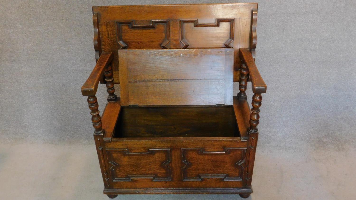 A mid 20th century oak Jacobean style monk's bench with sliding metamorphic back. H.78 W.93 D.46cm - Image 2 of 5