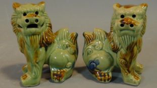 A pair of Chinese ceramic Fo dogs. H.14cm