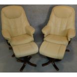 A pair of leather swivelling adjustable reclining armchairs with matching footstools. H.106cm