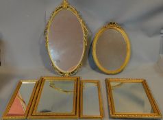 A gilt framed triptych dressing table mirror and three other gilt wall mirrors. 66x44cm (largest)