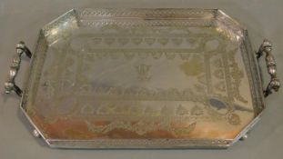 A heavy Victorian silver plated tray with pierced gallery and floral engraving. 65x39cm