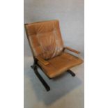 A 1970's vintage brown leather upholstered plywood armchair by Ingmar Relling by Westnofa.