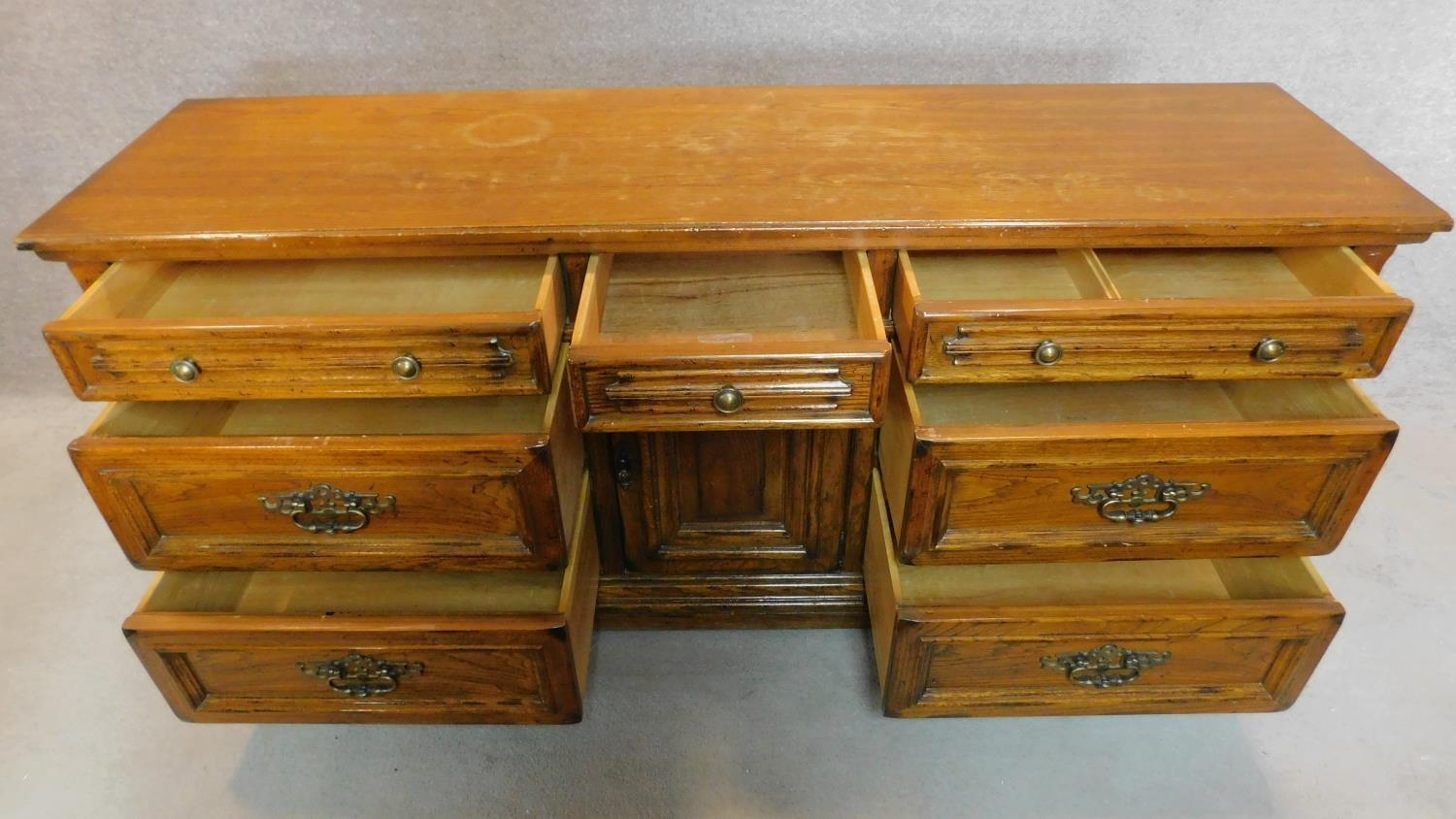 A French provincial style oak sideboard fitted with an arrangement of drawers and a central cupboard - Image 2 of 6