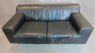WITHDRAWN - An Italian black leather sofa on solid block feet. 73x177x97cm (bought from Heal's, pair