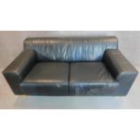 WITHDRAWN - An Italian black leather sofa on solid block feet. 73x177x97cm (bought from Heal's, pair