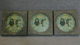 A set of three framed and glazed display cases containing old padlocks and keys. 40x40cm